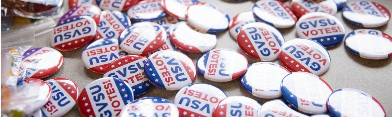 Red, white, and blue GVSU Votes buttons